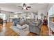 Bright living room featuring hardwood floors, comfortable seating, and open concept design at 15 Willow Oaks Ct, Taylorsville, NC 28681