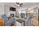 Open-concept living area with fireplace, comfortable seating, and view to kitchen area at 15 Willow Oaks Ct, Taylorsville, NC 28681