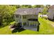 Aerial view of the home with a well-maintained lawn and landscaping at 15002 Strathmoor Dr, Charlotte, NC 28277