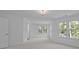 Bright bedroom with 3 windows and neutral carpet at 15002 Strathmoor Dr, Charlotte, NC 28277