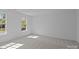 Bright bedroom with 2 windows and neutral carpet at 15002 Strathmoor Dr, Charlotte, NC 28277