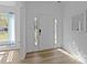 Bright foyer with decorative glass on the front door and mirror for final checks before leaving home at 15002 Strathmoor Dr, Charlotte, NC 28277