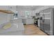 This spacious kitchen is equipped with stainless steel appliances and white cabinets at 15002 Strathmoor Dr, Charlotte, NC 28277