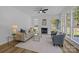 Well-lit Living room with fire place and numerous windows for ample natural light at 15002 Strathmoor Dr, Charlotte, NC 28277