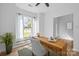 Inviting home office featuring a modern desk, comfortable chair, and a view of the neighborhood at 15002 Strathmoor Dr, Charlotte, NC 28277