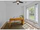 Bright office space with a wooden desk, natural light from the large window, and neutral decor at 15002 Strathmoor Dr, Charlotte, NC 28277
