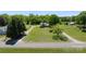 Sprawling aerial view of the home with a long driveway, surrounded by lush greenery and mature trees at 155 Jackson Rd, Salisbury, NC 28146