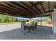 Outdoor seating area with shaded cover, views of the yard, and stone driveway at 155 Jackson Rd, Salisbury, NC 28146
