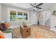 Inviting living room featuring neutral walls, stylish rug, and an open staircase at 155 Jackson Rd, Salisbury, NC 28146