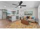 Bright living room showcases an open floor plan into the kitchen with a ceiling fan and stylish decor at 155 Jackson Rd, Salisbury, NC 28146