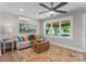 Cozy living room with natural light, decorative rug, and modern ceiling fan at 155 Jackson Rd, Salisbury, NC 28146
