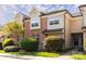 Inviting townhome featuring a mix of brick and siding, well-maintained landscaping, and charming curb appeal at 1716 Termini Dr, Charlotte, NC 28262