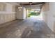 Spacious attached garage featuring an entry door and automatic garage door opener at 1716 Termini Dr, Charlotte, NC 28262