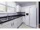 Kitchen with stainless steel appliances, neutral backsplash, and light cabinetry provides a clean and modern look at 1716 Termini Dr, Charlotte, NC 28262