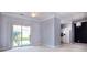 Cozy living space with light walls, plush carpeting, and sliding glass door with access to outdoor greenery at 1716 Termini Dr, Charlotte, NC 28262