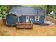 An aerial view shows the back of the home and the wooden deck in the backyard at 1913 Garibaldi Ave, Charlotte, NC 28208