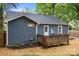 The wooden back deck is perfect for relaxing and enjoying the privacy of the backyard at 1913 Garibaldi Ave, Charlotte, NC 28208