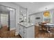 Open-concept kitchen flows into the living and dining areas, featuring granite countertops and modern finishes at 1913 Garibaldi Ave, Charlotte, NC 28208