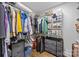 Spacious walk-in closet with ample storage, featuring shelving and drawers for organization and convenience at 1913 Garibaldi Ave, Charlotte, NC 28208