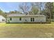 Expansive backyard featuring a wooden deck, grassy lawn and privacy at 1944 Garibaldi Ave, Charlotte, NC 28208