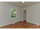 Bright bedroom with hardwood floors, closet, and natural light from the window at 1944 Garibaldi Ave, Charlotte, NC 28208