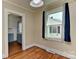 Bright dining room with hardwood floors and natural light from a large window at 1944 Garibaldi Ave, Charlotte, NC 28208