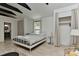 Main bedroom with beamed ceilings, neutral walls, and stylish decor at 1944 Garibaldi Ave, Charlotte, NC 28208