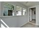 Sunroom featuring tiled floors and large windows providing views of the home's exterior at 1944 Garibaldi Ave, Charlotte, NC 28208
