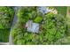 Aerial view of the home and surrounding mature trees on the large property at 19729 Callaway Hills Ln, Davidson, NC 28036