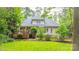 View of the home's rear exterior with a spacious deck and beautifully landscaped backyard at 19729 Callaway Hills Ln, Davidson, NC 28036
