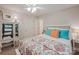 Inviting bedroom boasts a well-lit space, stylish decor, and a plush bed for relaxation and comfort at 19729 Callaway Hills Ln, Davidson, NC 28036