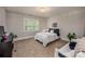 Cozy bedroom with a comfortable bed, large window, and a functional desk area, perfect for rest and productivity at 19729 Callaway Hills Ln, Davidson, NC 28036