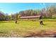 View of the horse barn and fenced pasture at 19729 Callaway Hills Ln, Davidson, NC 28036