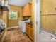 Well-lit laundry room with cabinetry and washer/dryer hookups at 19729 Callaway Hills Ln, Davidson, NC 28036