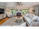Comfortable living room showcases a fireplace, hardwood floors, and natural light streaming through the windows at 19729 Callaway Hills Ln, Davidson, NC 28036