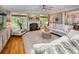 Bright living room showcases a fireplace, hardwood floors, and natural light streaming through the windows at 19729 Callaway Hills Ln, Davidson, NC 28036