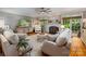 Comfortable living room showcases a fireplace, hardwood floors, and natural light streaming through the windows at 19729 Callaway Hills Ln, Davidson, NC 28036