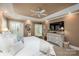 Spacious main bedroom with a tray ceiling, neutral tones, and plantation shutters at 19729 Callaway Hills Ln, Davidson, NC 28036
