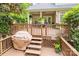 Outdoor porch with a grill, wooden deck, and ample seating, perfect for entertaining and enjoying the backyard at 19729 Callaway Hills Ln, Davidson, NC 28036