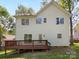 Exterior view of a home, featuring a wood deck and a well-maintained yard at 2405 Kalis Pl, Charlotte, NC 28262