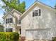 Charming two-story home with white siding, black shutters, and a two-car attached garage at 2405 Kalis Pl, Charlotte, NC 28262