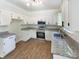 Bright kitchen featuring white cabinets, granite countertops, and stainless steel appliances at 2405 Kalis Pl, Charlotte, NC 28262