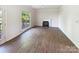 Bright living room with fireplace, hardwood floors and backyard views at 2405 Kalis Pl, Charlotte, NC 28262