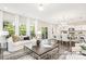 Inviting living space featuring an open layout, hardwood floors, and large windows at 2414 Morgan Hills Dr # 296P, Albemarle, NC 28001