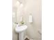 Well-lit powder room featuring a pedestal sink, decorative mirror, and neutral decor at 2414 Morgan Hills Dr # 296P, Albemarle, NC 28001