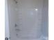 Clean bathroom with white tiled tub and shower combination at 2440 Mint Thistle Ct, Charlotte, NC 28269