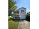 Charming two-story home featuring a covered porch, stone accents, and an attached one-car garage at 2440 Mint Thistle Ct, Charlotte, NC 28269