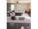 Staged living room with comfortable seating and modern decor at 2440 Mint Thistle Ct, Charlotte, NC 28269