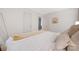 Bright bedroom featuring a comfortable bed with white linens and neutral accents, plus a mirror at 2601 Dora Dr, Charlotte, NC 28215