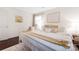 Bedroom featuring a large bed with neutral pillows, a window, and natural light at 2601 Dora Dr, Charlotte, NC 28215